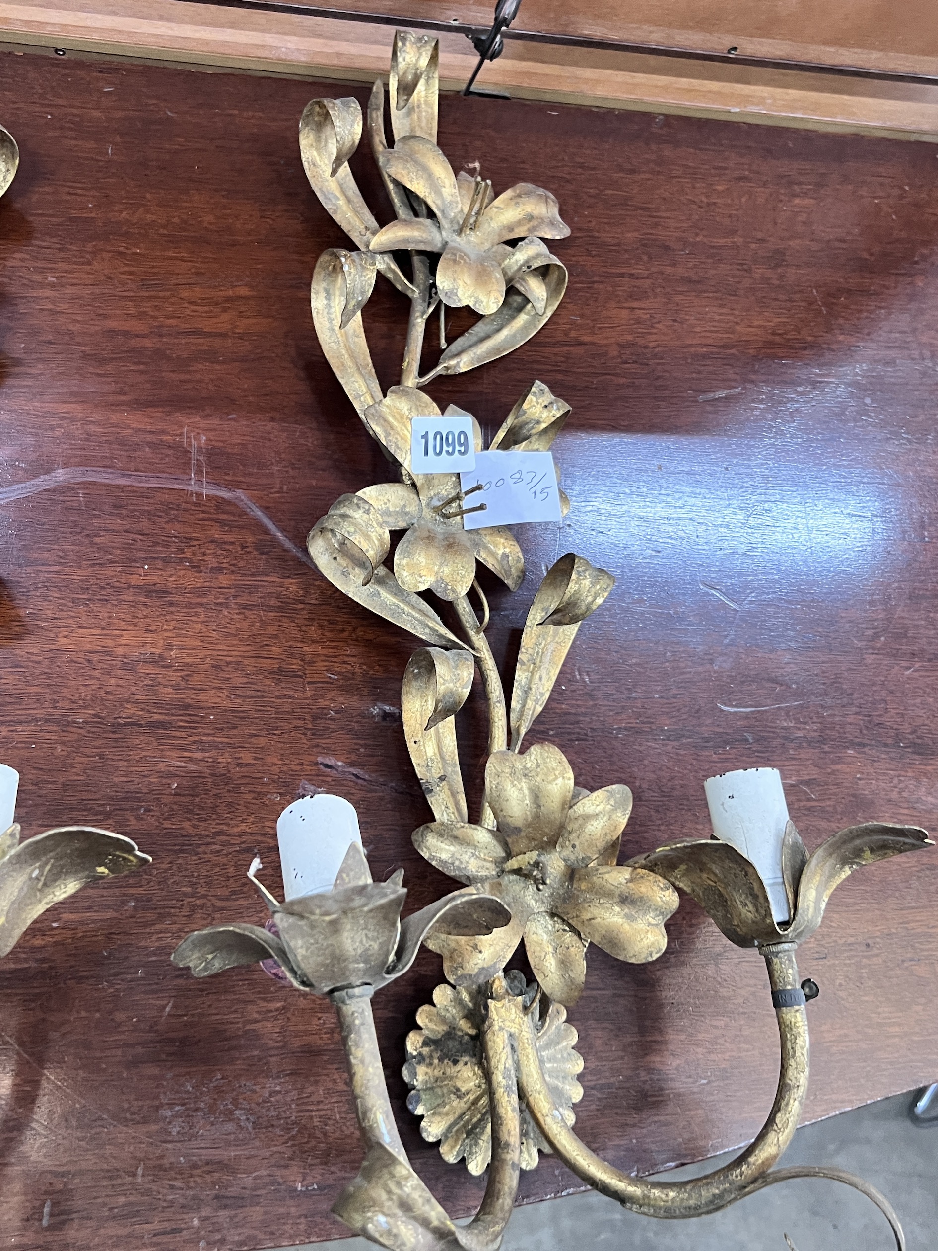A set of three gilt metal floral two branch wall lights